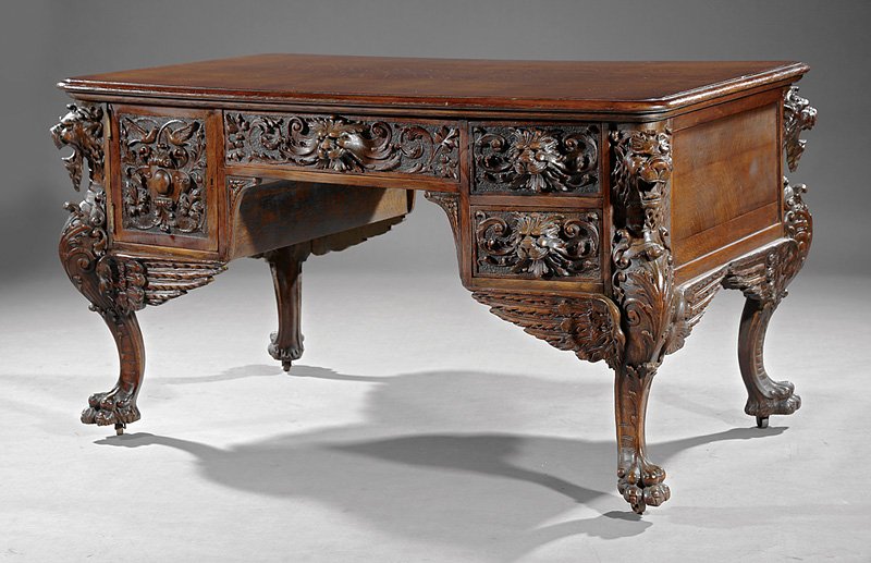 Highly Carved Oak Partner's Desk, prob. Horner: American Highly Carved Oak Partner's Desk, c. 1880-1900, probably R.J. Horner, New York, molded top, each side with kneehole configuration of drawers and doors, lion's mask pulls, griffin carved legs,