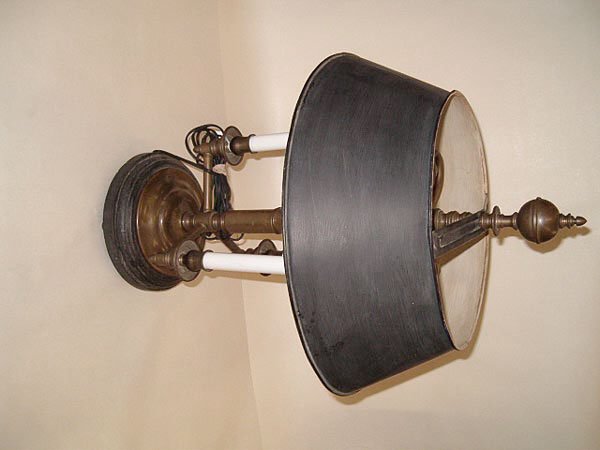 A Brass and Ebonized Wood Two-Light Colonial Revi