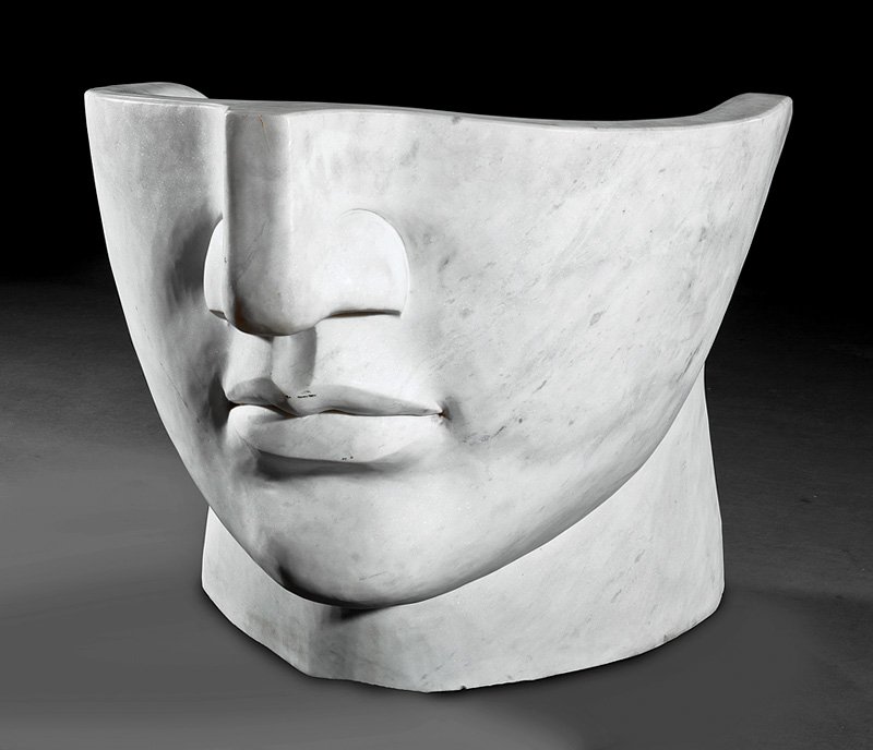 Pair of Art Moderne Marble Figural Bergeres: Pair of Art Moderne Marble Figural Bergeres, 20th c., each barrel back with lower visage of Michelangelo's David, h. 28 in., w. 30 1/4 in., d. 27 in