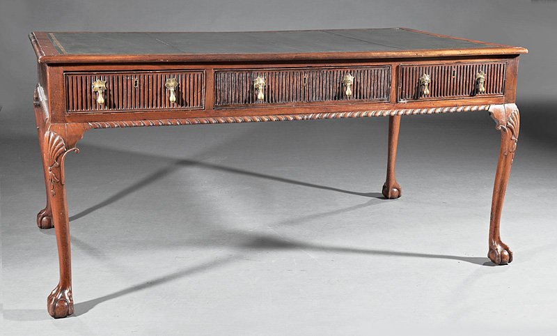 George III-Style Carved Mahogany Partner's Desk: Antique George III-Style Carved Mahogany Partner's Desk, parcel gilt tooled leather top, fluted frieze drawers, gadrooned skirt, cabriole legs, ball-and-claw feet, h. 28 5/8 in., w. 58 1/2 in., d. 34 