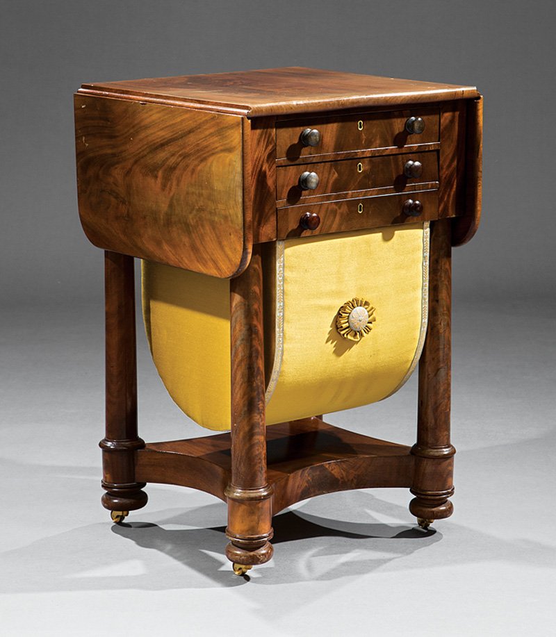 American Classical Carved Mahogany Work Table: American Classical Carved Mahogany Work Table, c. 1820-1830, New York, manner of Duncan Phyfe, drop leaf top, 2 drawers and pull out work basket, columnar supports, incurvate plinth, disc feet, caster