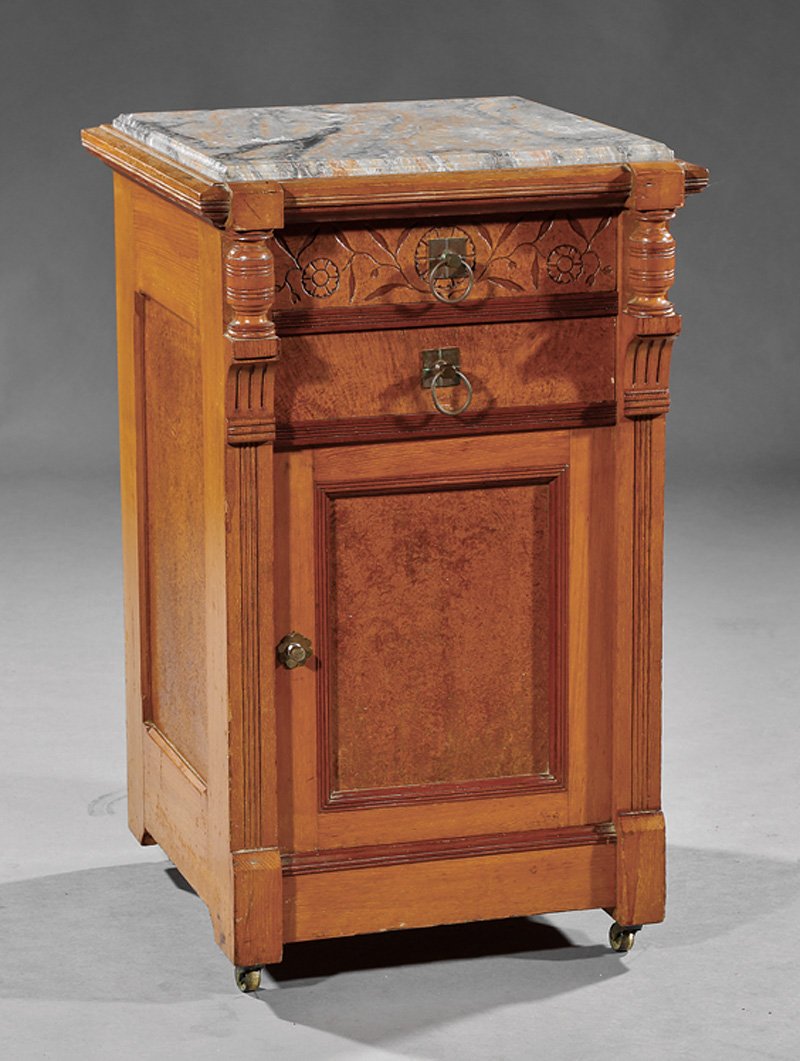 Carved and Burled Maple Bedside Commode: American Renaissance Carved and Burled Maple Bedside Commode, late 19th c., in the manner of Pabst, marble top, two drawers over door, molded base, casters, h. 29 in., w. 17 1/2 in., d. 18 in