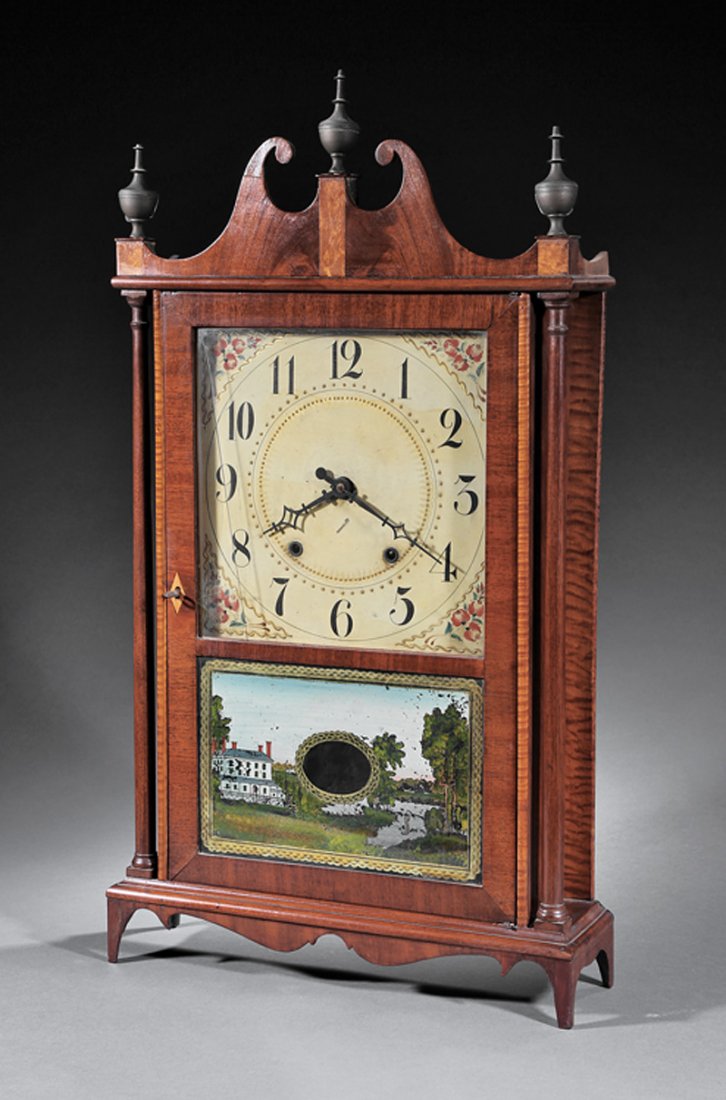 Eli Terry Maple Pillar and Scroll Clock: American Mahogany and Curly Maple Pillar and Scroll Clock, c. 1820, Eli Terry, Plymouth, CT, broken arch cornice, turned columns, eglomise panel with manor house, h. 31 in., w. 17 1/2 in., d. 4 3/4 in