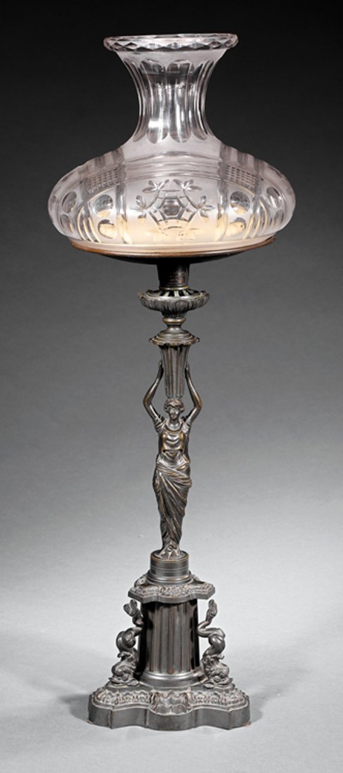 Sinumbra Lamp, marked W. Carleton: American Patinated Bronze Figural Sinumbra Lamp, c. 1840, marked "Manufactured by / W. Carleton / Boston", Classical maiden standard, fluted base mounted with dolphins, h. 29 1/2 in., dia. 9 1/2 in. P
