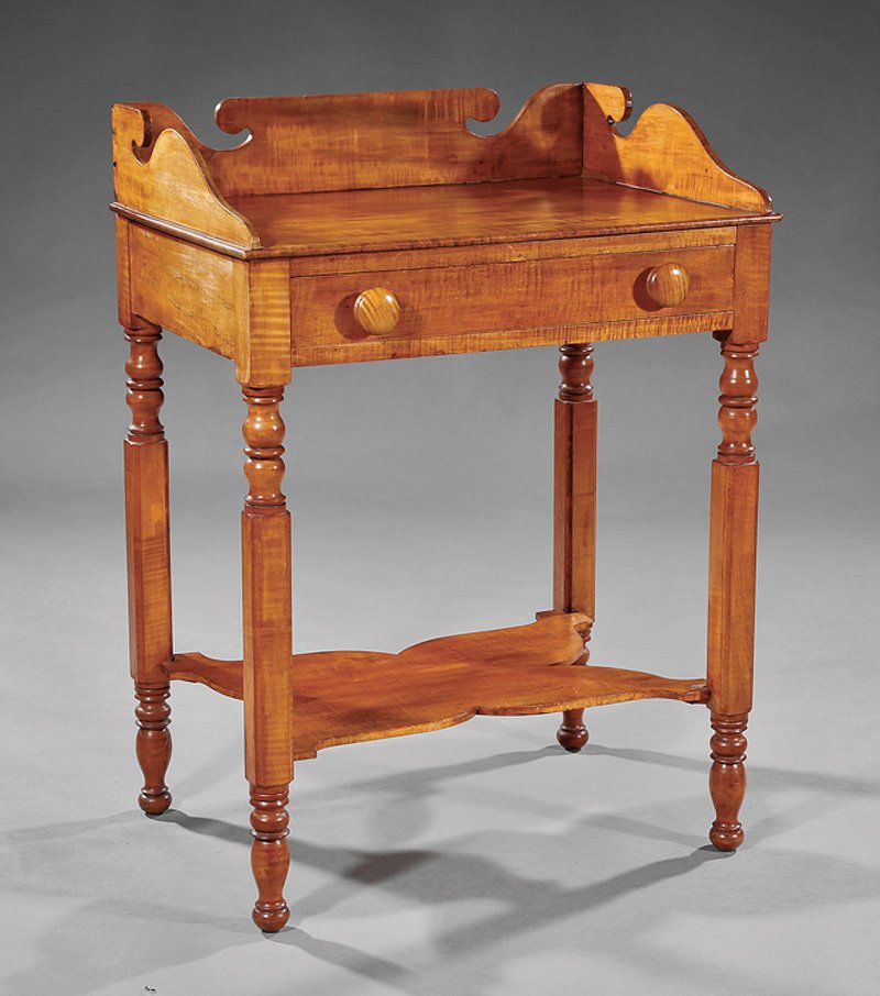 American Late Federal Curly Maple Washstand: American Late Federal Curly Maple Washstand, c. 1840, scrolled backsplash, frieze drawer, turned and blocked legs, shaped stretcher shelf, h. 32 3/4 in., w. 24 1/4 in., d. 17 1/4 in. Provenance: The S