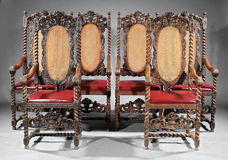 Six Jacobean-Style Carved Oak and Caned Armchairs: Set of Six Jacobean-Style Carved Oak and Caned Armchairs, late 19th c., each with central urn and cherub crest, barley-twist stiles, scrolled arms, pierced front splat, drop-in leather seat, h. 54 1/4