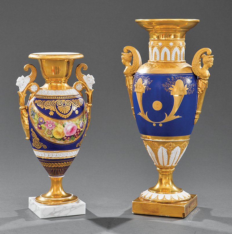 Paris Porcelain Cobalt and Gilt Amphora Vases: Two Paris Porcelain Cobalt and Gilt Decorated Amphora Vases, 19th c., one with Nike handles, marked "Schoelcher", h. 12 7/8 in.; and another with lion's mask handles, h. 10 5/8 in. Note: Restorations.