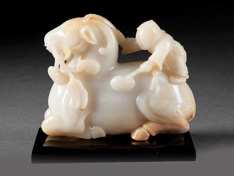 Chines Yellowish-White and Russet Jade Ram & Boy: Chinese "Mutton Fat" Yellowish-White and Russet Jade Ram and Boy Group, probably 17th c., carved as a young boy holding a lingzhi spray and grasping the horn of a recumbent ram, Ashkenazie label, h. 4