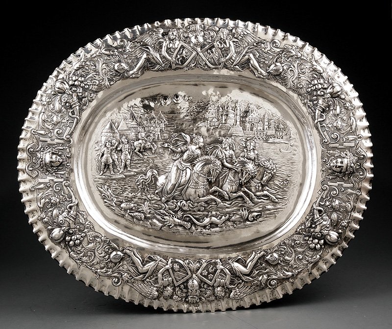 Continental Silver Repousse Charger: Continental Silver Repousse Charger, probably German, late 19th/early 20th c., elaborately decorated overall in high relief, 19 in. x 22 3/4 in., wt. 64.45 troy ozs. Provenance: Francis Purcell, New H