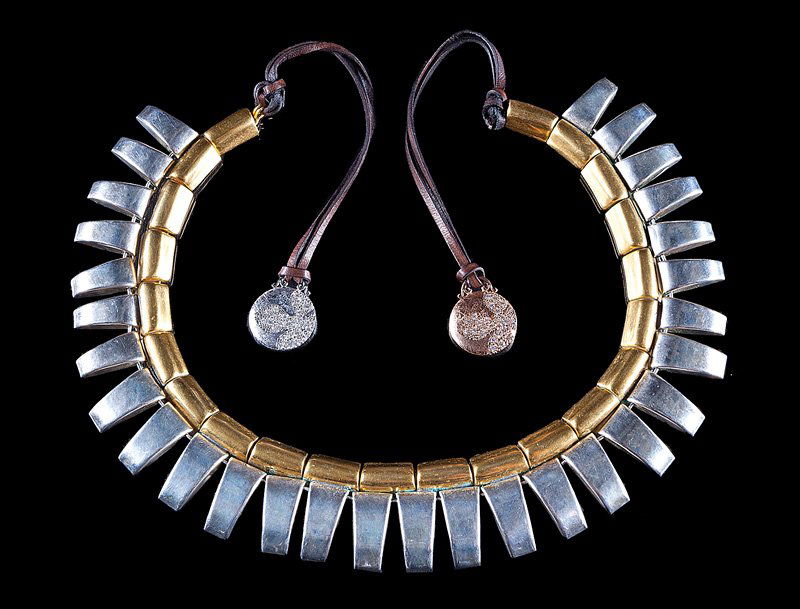 Robert Lee Morris Brass, Metal, Leather Necklace: Robert Lee Morris "Tribal" Brass, White Metal and Leather Necklace, with 14 kt. white and rose gold disks set with pavé single cut diamonds, l. 14 in