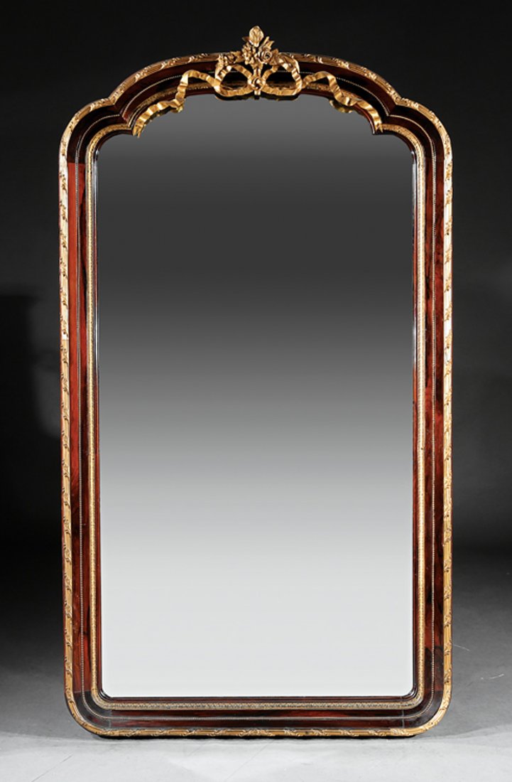 Gilt Bronze-Mounted Rosewood Mirror: Antique Neoclassical-Style Gilt Bronze-Mounted Rosewood Mirror, beribboned floral crest, shaped mirror plate, reeded, foliate, and beaded frame, h. 78 1/2 in., w. 43 in. Provenance: Estate of Mina Ann