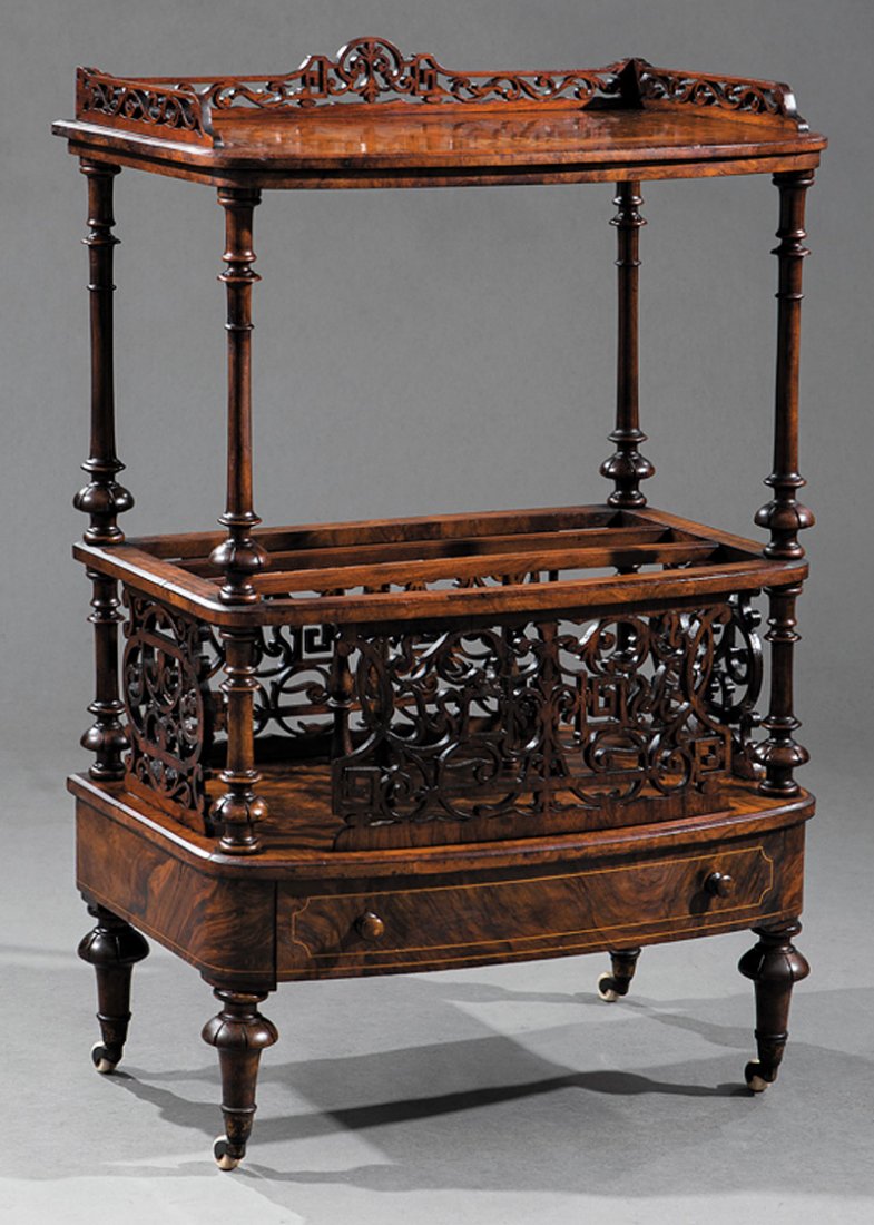 English Carved and Burl Walnut Canterbury: English Carved and Burl Walnut Canterbury, late 19th c., reticulated gallery, inlaid top, turned supports, reticulated dividers, base drawer, toupie feet, casters. h. 37 in., w. 24 in., d. 16 in.