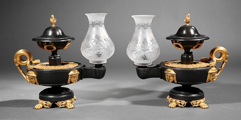 Gilt and Patinated Bronze Argand Lamps: Pair of Regency Egyptian Revival Gilt and Patinated Bronze Argand Lamps, c. 1820, possibly William Bullock, classical oil lamp form, serpent handles, mounted with laurel wreaths and pharaoh heads, paw