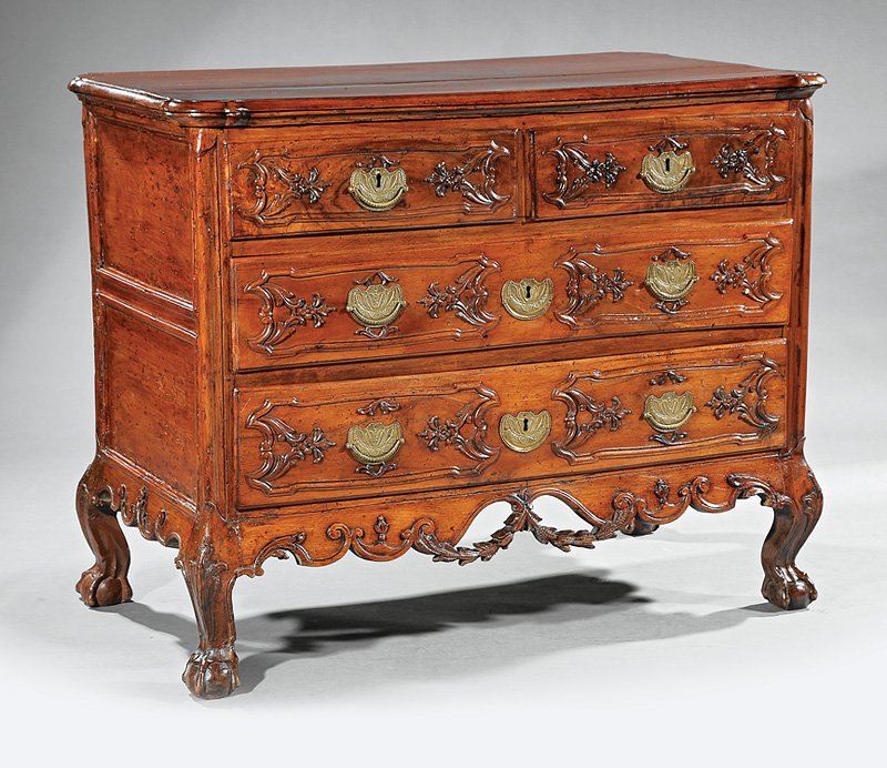 Portuguese Rococo Carved Walnut Commo: Antique Portuguese Rococo Carved Walnut Commode, probably late 18th c., shaped molded top, two short over two long graduated drawers, shaped apron, cabriole legs, claw and ball feet, h. 38 1/2 in., w.