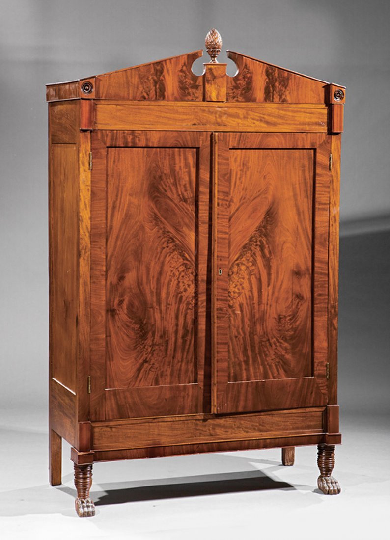 American Federal Mahogany Armoire: American Federal Mahogany Armoire, c. 1810, Philadelphia, broken pediment cornice with pineapple finial, figured cabinet doors, later shelves, beehive legs, paw feet, h. 78 in., w. 46 1/2 in., d. 19 i