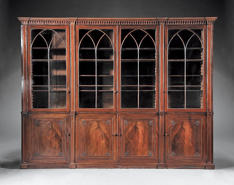 Regency Mahogany Bookcase: Regency Mahogany Bookcase, early 19th c., dentil molded and lancet arch cornice, arched astragal glazed doors, reeded shelf interior; highly figured cabinet doors, molded base, h. 95 in., w. 124 1/4 i