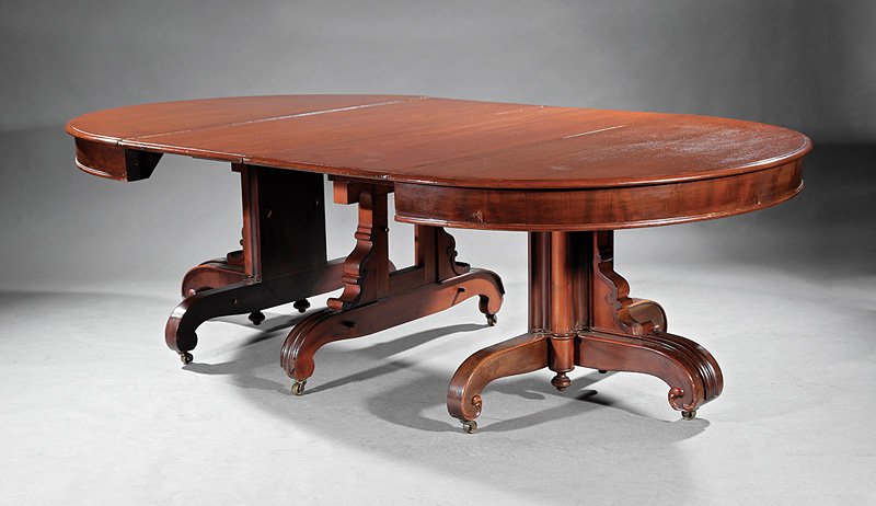 Walnut Extension Dining Table: Antique Walnut Extension Dining Table, demilune ends, tubular standard, scrolled brackets, scrolled legs, casters, with three leaves, h. 28 1/4 in., closed l. 53 in., extended l. 112 in., w. 54 in. Pr