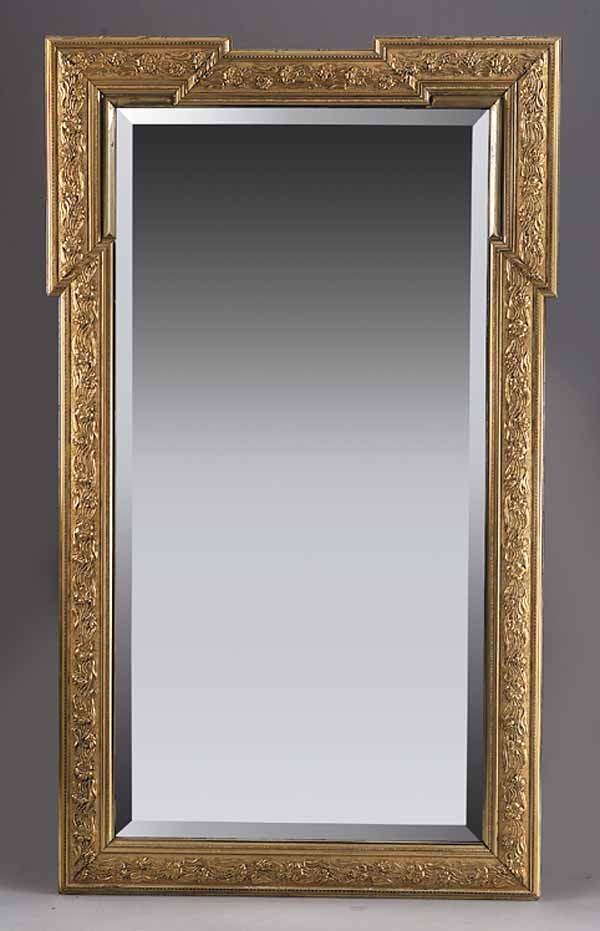 Antique Dutch Art Nouveau Giltwood Mirror: An Antique Dutch Art Nouveau Giltwood Mirror, late 19th c., the outer frame with a raised design of lilies, the inner border beaded and molded, with blocked corners and beveled glass, retains original