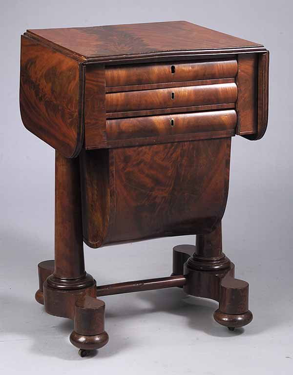 Carved Mahogany Drop-Leaf Work Table: A Fine American Classical Carved Mahogany Drop-Leaf Work Table, early 19th c., in the manner of Duncan Phyfe, New York, the top having a reeded edge above two drawers, and shaped work basket, raised o