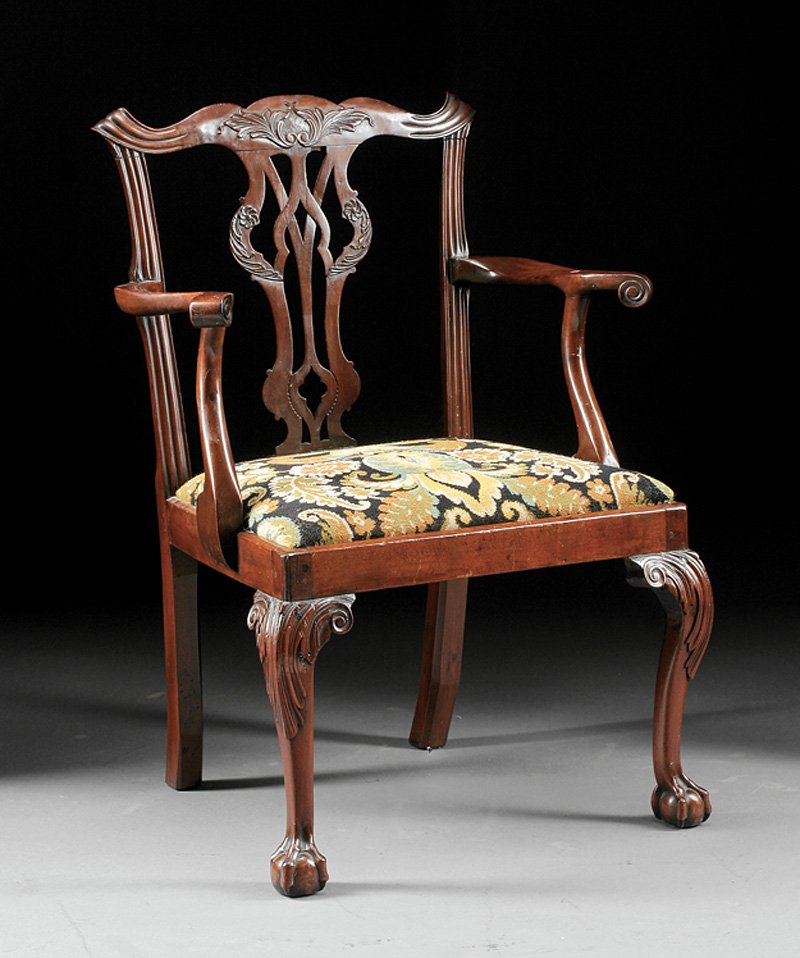 George III Carved Mahogany Armchair: George III Carved Mahogany Armchair, 18th c., serpentine crest, interlaced splat, serpentine arms, needlepoint slip seat, acanthus-carved cabriole legs, ball and claw feet. Note: Restorations