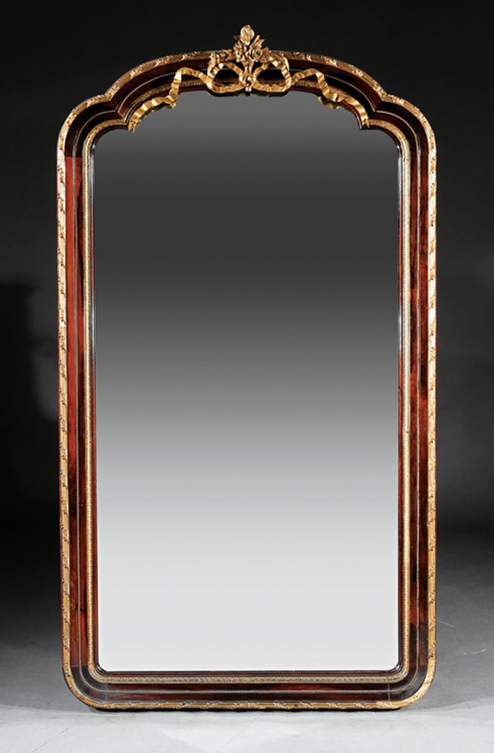 Gilt Bronze-Mounted Rosewood Mirror: Antique Neoclassical-Style Gilt Bronze-Mounted Rosewood Mirror, beribboned floral crest, shaped mirror plate, reeded, foliate, and beaded frame, h. 78 1/2 in., w. 43 in. Provenance: Estate of Mina Ann