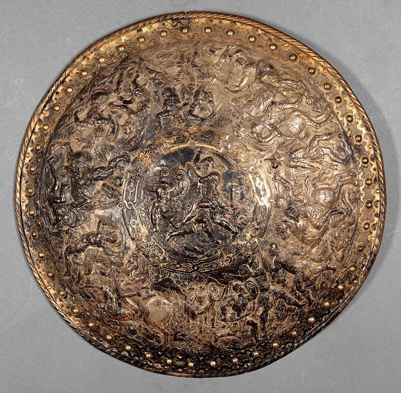 Continental Parcel Gilt Electrotype Shield: Continental Parcel Gilt Electrotype Shield, with relief battle scenes, in the style of the 16th and 17th c. schools of Nuremberg and Augsburg, dia. 22 1/2 in