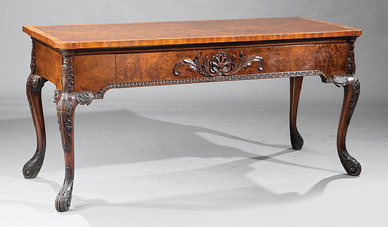 Irish Rococo Carved Mahogany Serving Table: Fine Irish Rococo Carved Mahogany Serving Table, probably early 20th c., after Thomas Chippendale, lightwood banded top, long shell-carved drawer, egg and dart molding, acanthus and shell-carved cabri