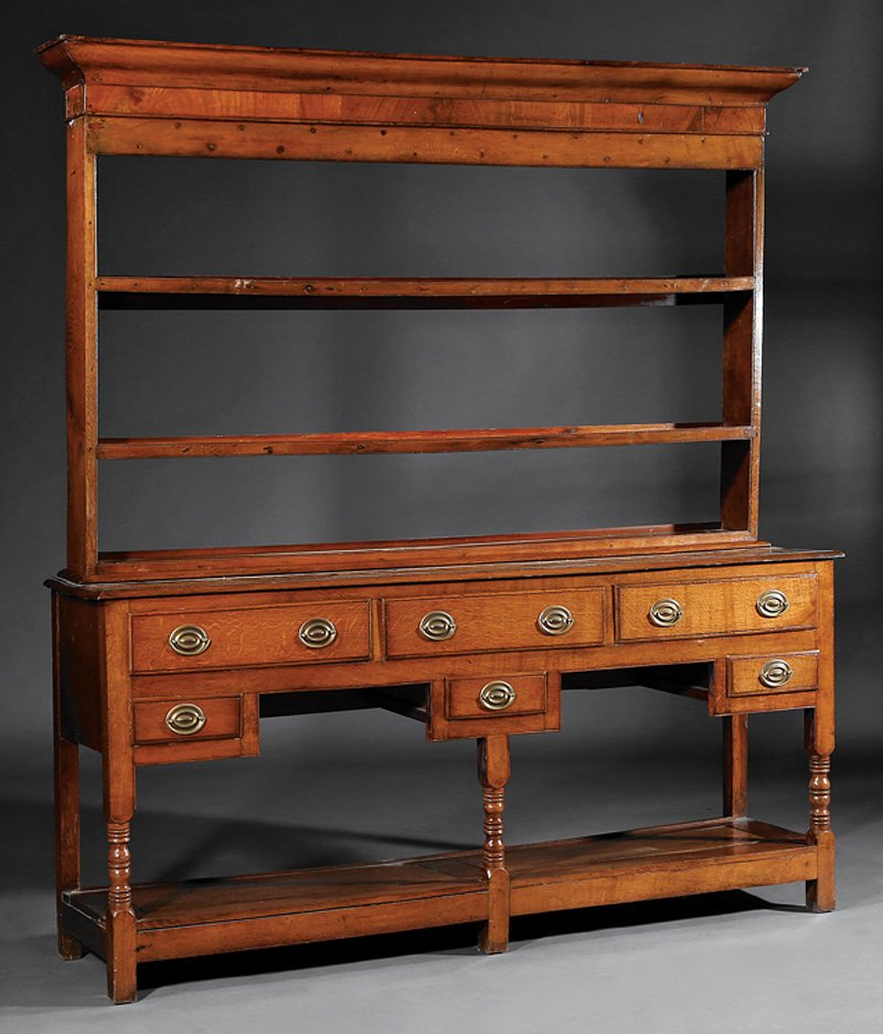 English Oak Welsh Dresser: Antique English Oak Welsh Dresser, 19th c., plate rack with molded cornice, base with three long and three short drawers, blocked and turned legs, stretcher shelf