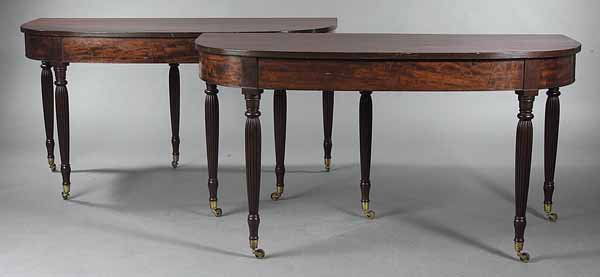 Pair of American Late Federal Mahogany Console Ta: A Pair of American Late Federal Mahogany Console Tables , c. 1825, each "D" shaped reeded edge top above a plain frieze, the bulbous reeded and ring-turned legs ending in brass cup casters, and with a