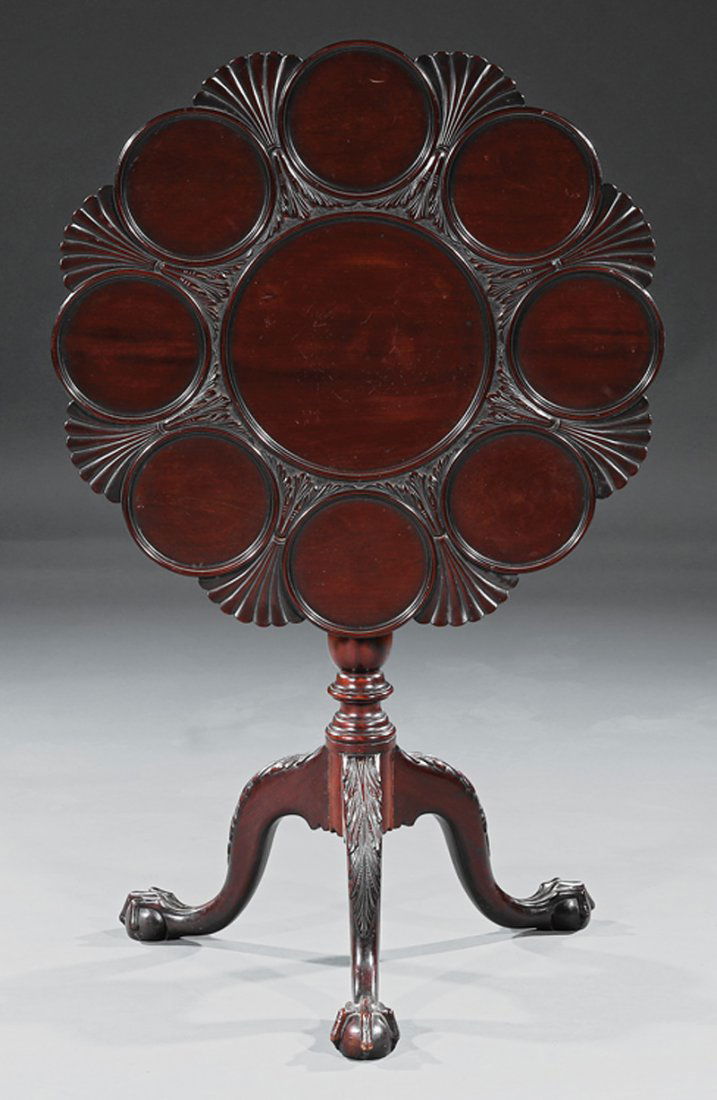 Irish Carved Mahogany Supper Table: Fine Antique Irish Carved Mahogany Supper Table, 19th c., after the designs of Thomas Chippendale, dished swivel top, baluster support, acanthus carved arched legs, ball and claw feet, h. 28 1/2 in.,