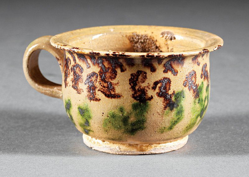 George Ohr Novelty Cup: George Ohr Novelty Cup, stamped mark, mustard ground, green and brown decoration, interior with "surprise", h. 1 7/8 in., dia. 3 1/8 in