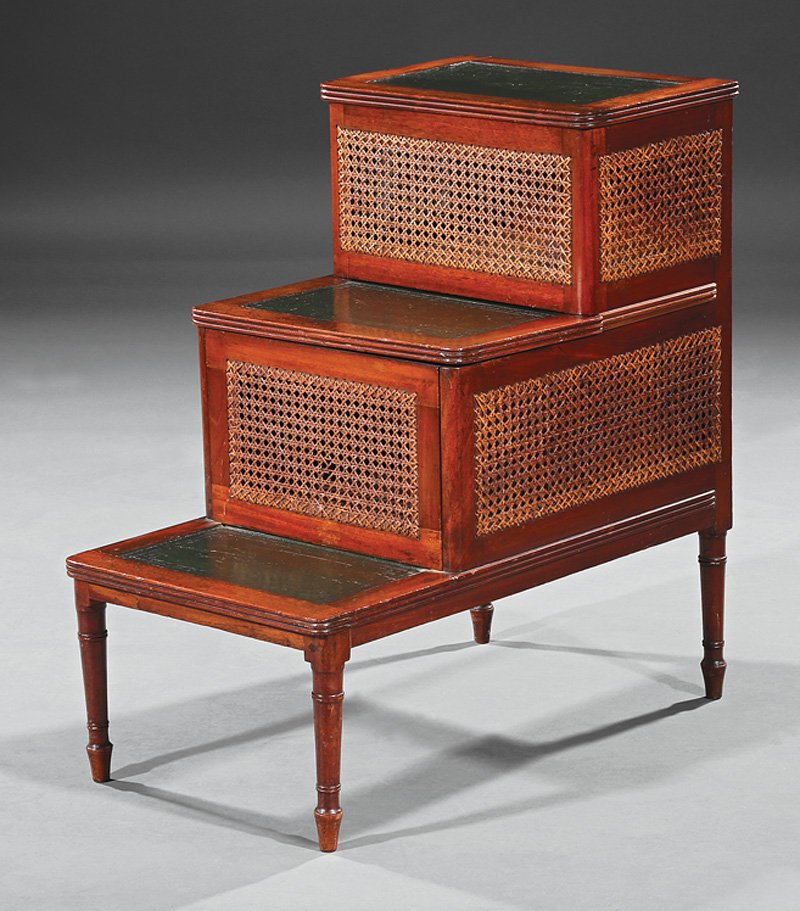 Sheraton Carved Mahogany Bedstep: Sheraton Carved Mahogany Bedstep, probably 19th c., leather inset treads with hinged tops, center commode, caned panels, turned legs, h. 15 3/4 in., w. 28 1/4 in., d. 27 in