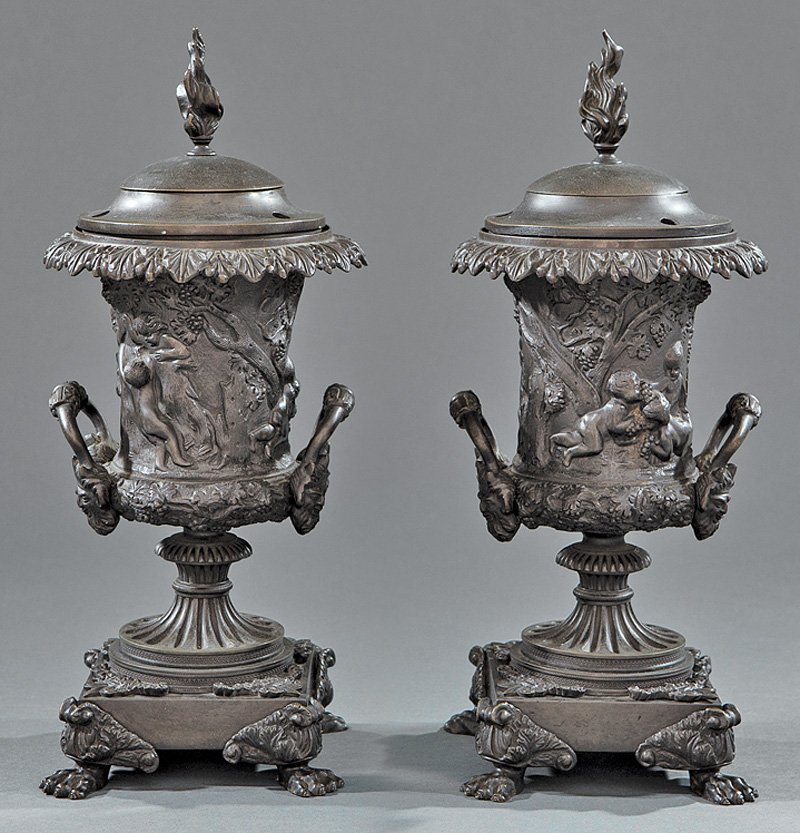 Pair of English Patinated Bronze Argand Lamps: Pair of English Patinated Bronze Argand Lamps, early 19th c., attr. to Thomas Messenger and Sons, Birmingham, classical relief decorated urn, with openwork handles, mounted with satyr masks, square ba