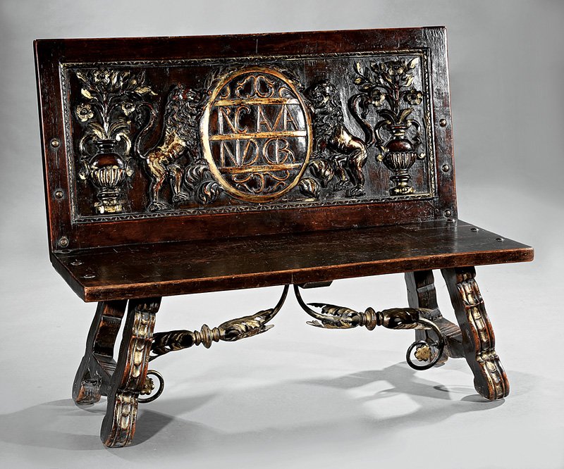 Italian Baroque-Style Hall Bench: Italian Baroque-Style Carved Walnut, Parcel Gilt and Iron Hall Bench, molded back with coat of arms, plank seat, splayed legs joined by scrolled iron stretcher, h. 39 in., w. 49 in., d. 17 1/4 in