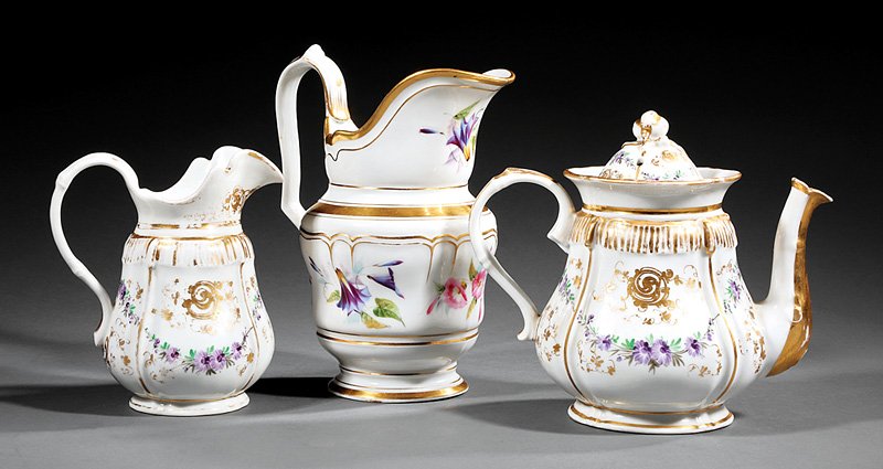 Group of Paris Porcelain Table Articles: Group of Paris Porcelain Table Articles, mid-19th c., incl. pitcher, h. 8 1/2 in., and teapot with matching creamer, polychrome floral decoration with gilt highlights, floral decoration. Provenance: M
