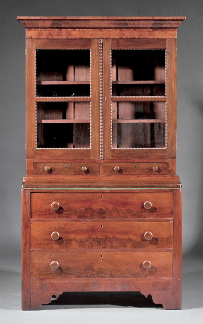 American Late Classical Secretary-Bookcase: American Late Classical Mahogany Secretary-Bookcase, mid-19th c., ogee cornice, beaded glazed doors over two short drawers, foldover writing surface, three graduated drawers, shaped bracket feet, h. 7
