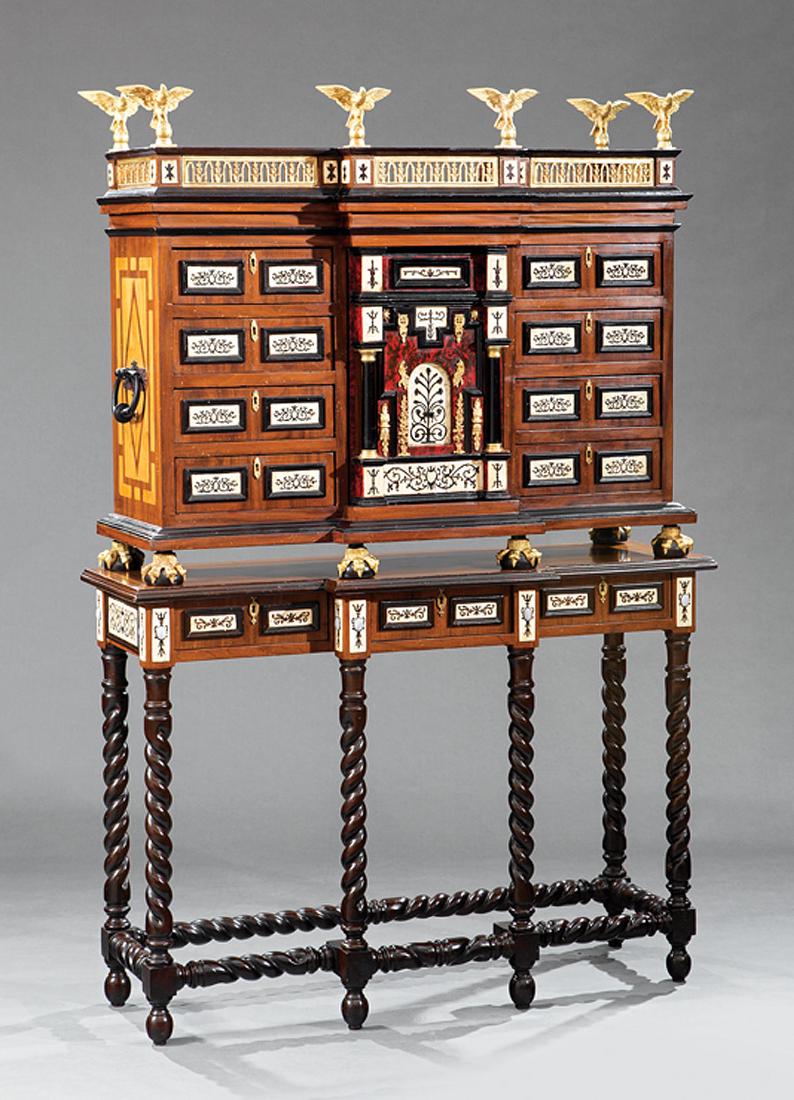 Inlaid, Ebonized, Metal-Mounted Vargueno on Stand: Spanish Renaissance-Style Bone Inlaid, Ebonized and Gilt Metal-Mounted Vargueno on Stand, eagle-mounted reticulated cornice, case with small drawers flanking a columned faux "door", paw feet, on confo