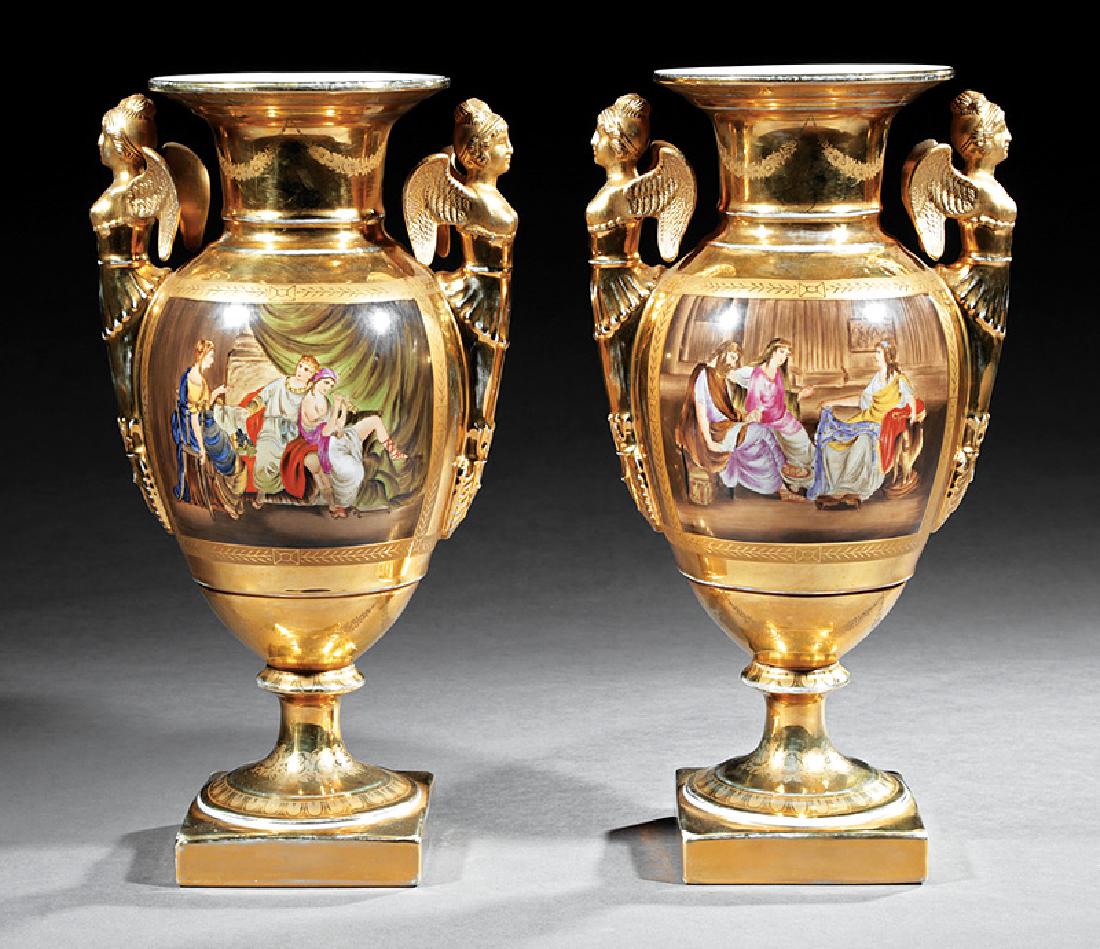 Continental Gilt and Polychrome Porcelain Vases: Pair of Continental Gilt and Polychrome Porcelain Vases, 19th c., apocryphal KPM mark, classical reserves, floral decoration, winged bust handles, h. 16 1/4 in., w. 8 1/2 in., d. 6 1/2 in