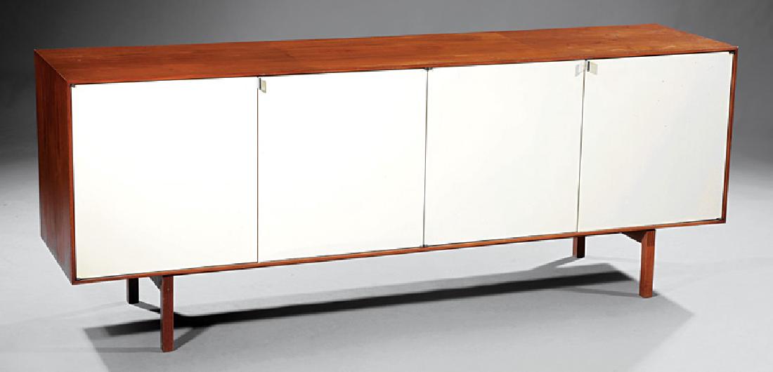 Florence Knoll Walnut and Lacquered Wood Credenza: Florence Knoll Walnut and Lacquered Wood Credenza, c. 1965, labeled "Knoll Associates, Inc., 320 Park Ave, NY", maple-veneered interior, fitted with adjustable shelves and two drawers, h. 29 in., w. 7