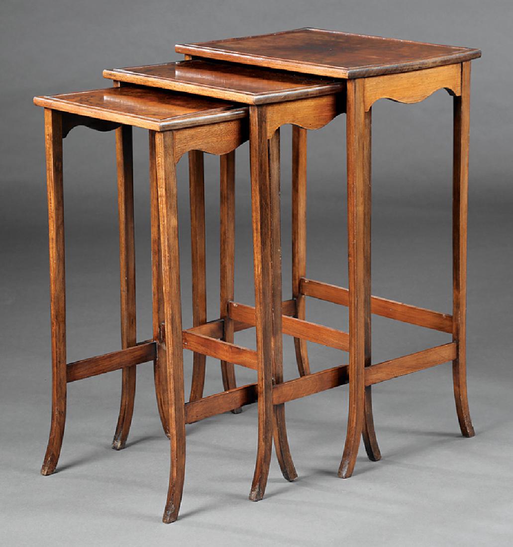 Three English Burled Walnut Nesting Tables: Three English Burled Walnut Nesting Tables, early 20th c., paneled tops, tapered flared legs, stretchers, h. 28 in., w. 17 1/2 in., d. 13 in