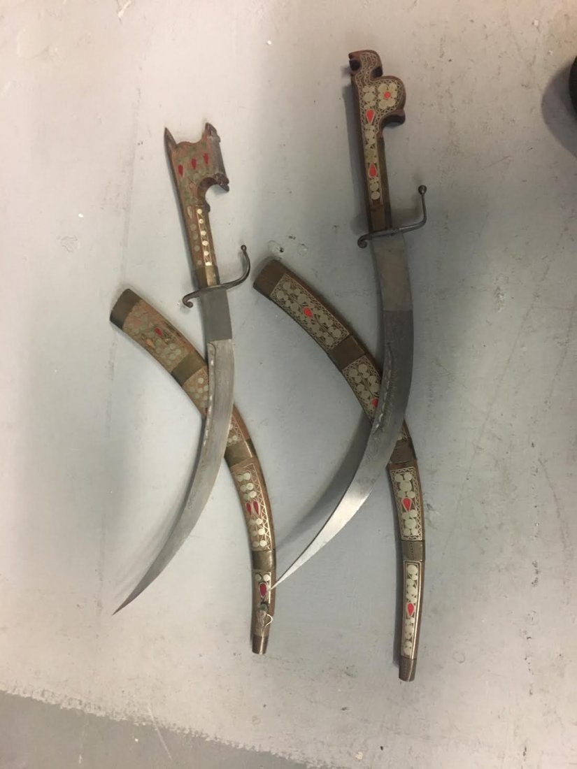 Pair of Indonesian Swords: Pair of wooden Indonesian swords. Measures 22.5" long