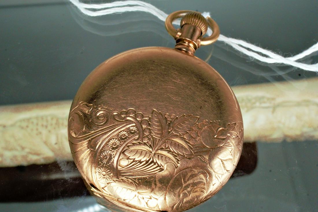 14k YG Waltham Pocket Watch A.W. & Co.: 14k Yellow gold engraved pocket watch case. Case serial number M7664. Porcelain face with Arabic hour and second markers. Blue steel breguete hands on an A. W. and Co. Waltham porcelain face. Weighs 1