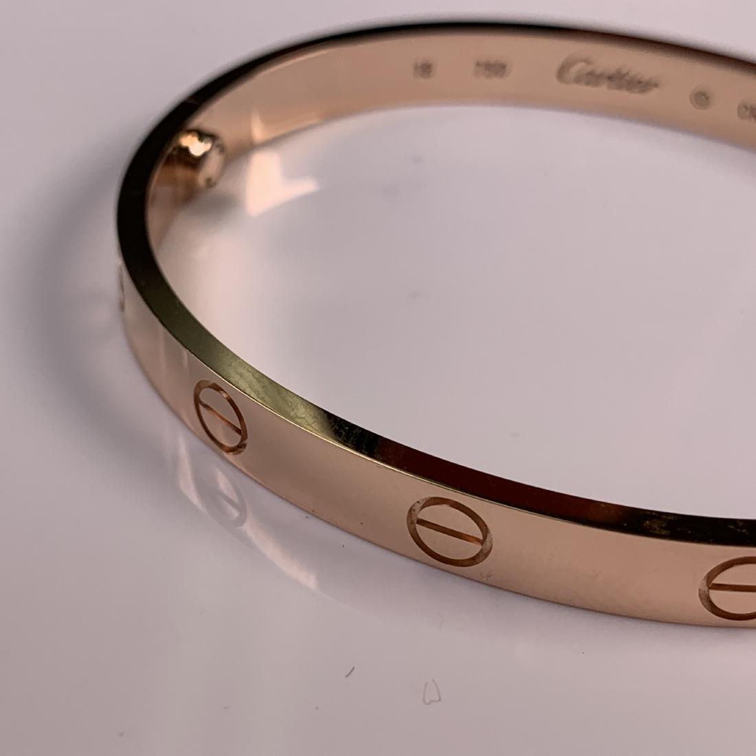 18k Rose Gold Love Bracelet: 18k Rose gold Love Bracelet in the manner of Cartier. Signed Cartier. With original tool and box. Size 18. Weighs 33.12 grams.