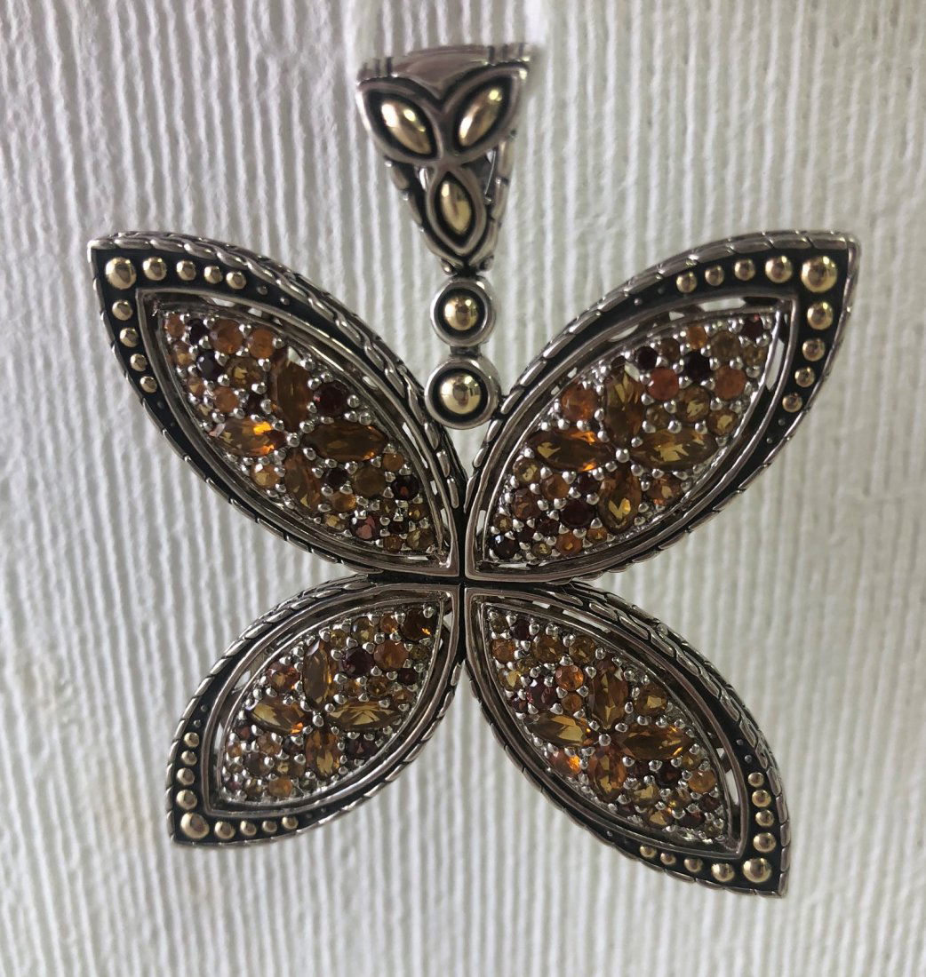 Large John Hardy Sterling & 18k Batu Pendant: Large John Hardy sterling and 18k gold 'Batu Kawung' pendant, four petal shape set with citrines and garnets. Marked "JH 18K 925". Approx. 2.5" x 2". Approx. weight 1.1 ounce.