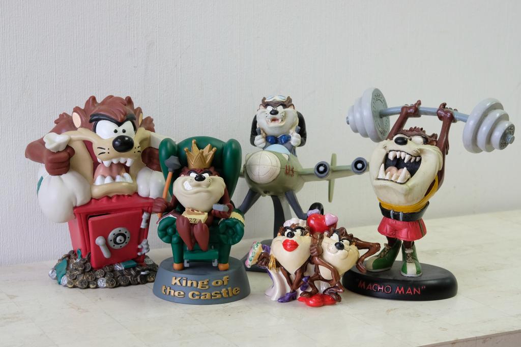 5 Looney Tunes Tasmanian Devil Figural Sculptures: Group of five Warner Bros. Looney Tunes Tasmanian devil figural sculptures,one a still bank all resin except for limited edition porcelain wedding figurine, Edition#88/300. Box and COA present for wed