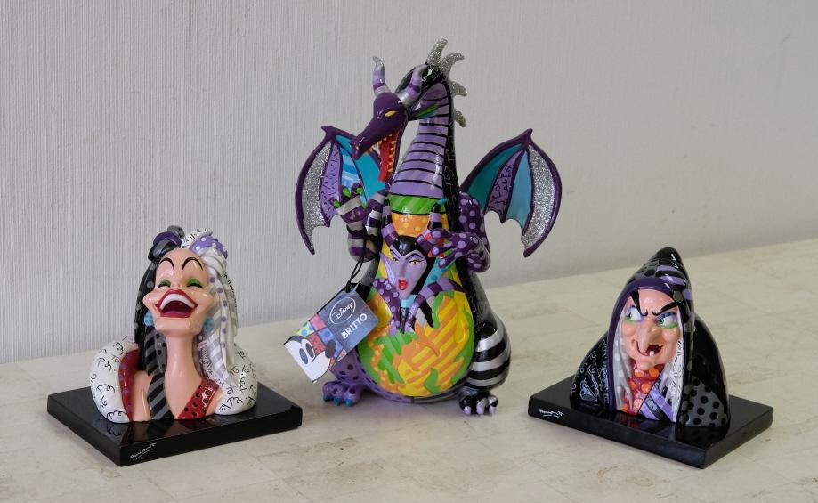 Group, 3 Britto Sculptures Disney Villains: Group of three Britto for Disney villian sculptures comprising Cruella de Vil, Maleficent Dragon and Wicked Witch Hag. All boxes present.