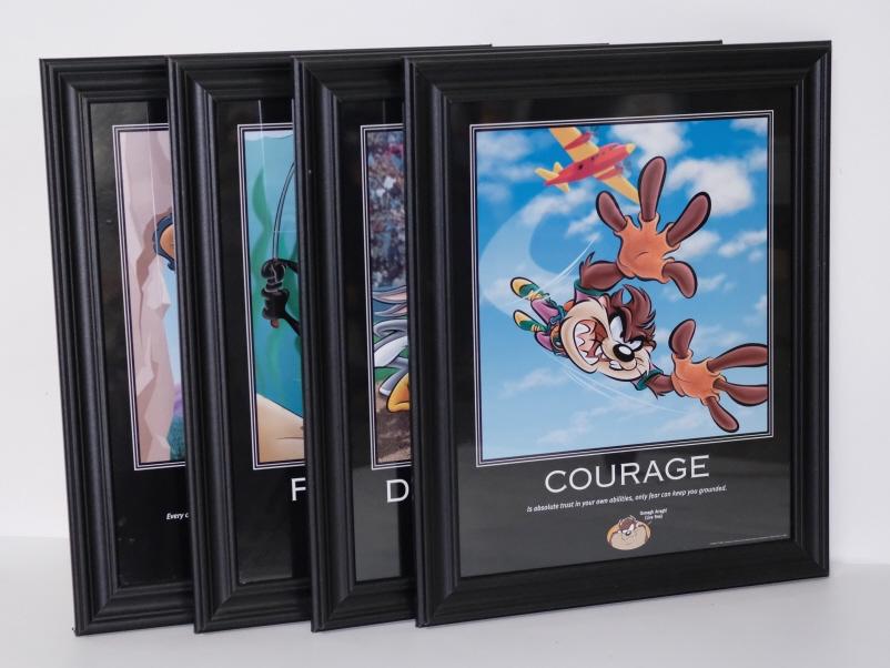 4 Vintage 1998 Looney Tunes Inspirational Prints: Group of four Warner Bros. Looney Tunes Inspirational prints from 1998 comprising "RISK","PERSISTENCE", "COURAGE" and "DETERMINATION". Each Print featuring a different Looney Tunes Character.Framed ap