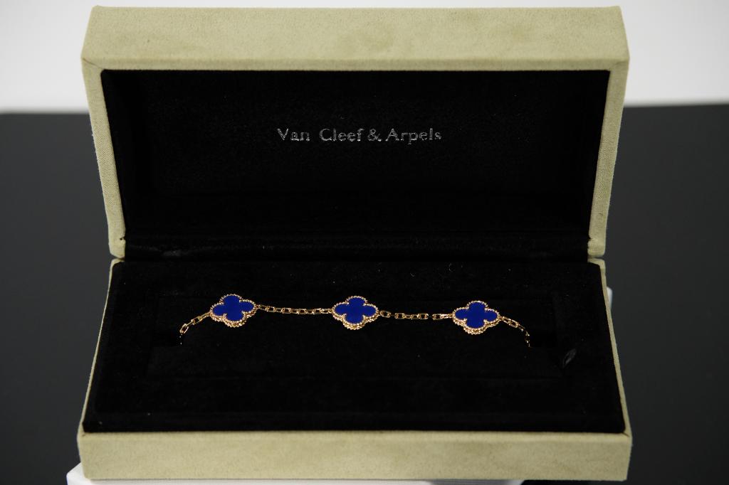 Van Cleef & Arpels Alhambra 5 Motif Agate Bracelet: 18k Yellow gold VCA 5 Motif Alhambra Bracelet Agate. Measures 7 inches/ 18 cm long and weighs 10.41g. In original box with paperwork.