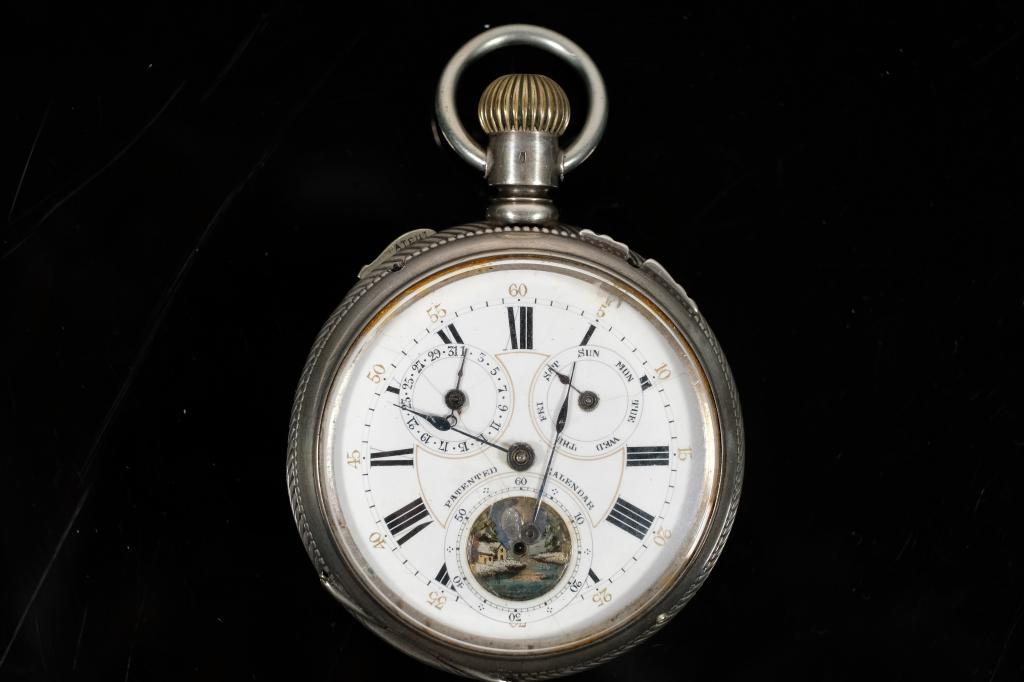 Continental Watch Co .800 Silver Pocket Watch: Continental Watch co open face pocket watch in.800 silver.Back interior case and back side of dust cover engraved 32141 and stamped .800 with hallmark of a rooster or bird.Front of dust cover engraved