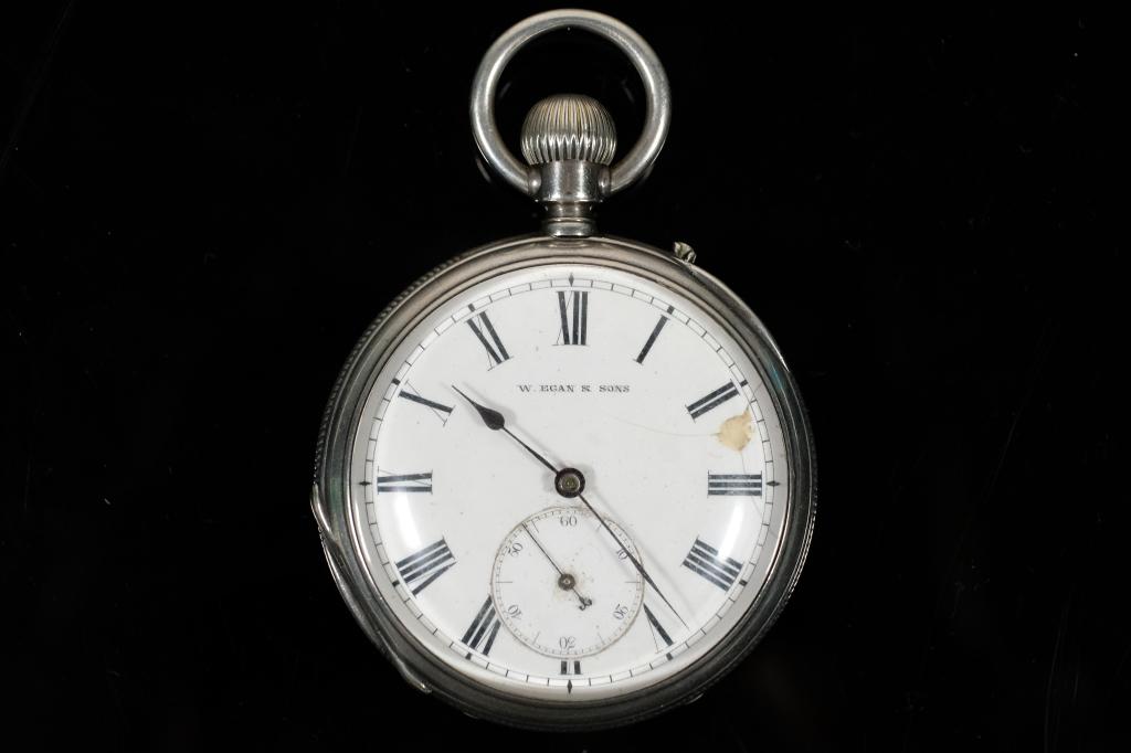 W. Egan & Sons Sterling Pocket Watch: W. Egan & Sons sterling silver open face pocket watch.Back interior cover engraved STERLING SILVER, D.F & C,71625.Dust cover engraved.EGAN & SONS/32 Patrick Street/CORK/ & Geneva.Movement Serial No. 7